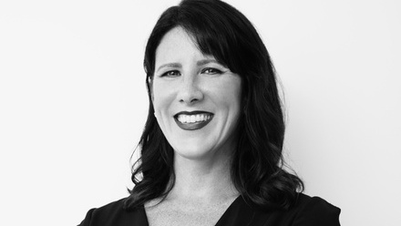 Headshot: Amanda Brill, a black and white image of a woman with dark hair.