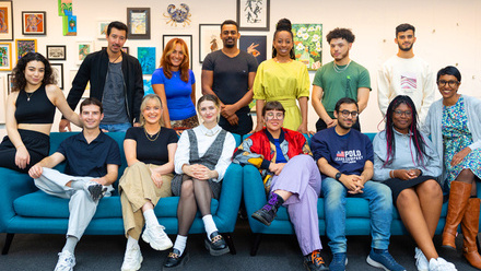 Photo of the Pact Indie Scheme 2023 - 24 participants. A diverse group of young people, some are standing the others are sitting in front of them.