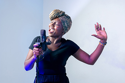 Image: black female singer with microphone