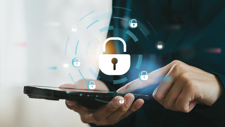 Person tapping a mobile phone with a secure digital lock icon.