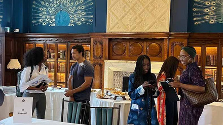 No Password Required programme participants networking in a dining hall.