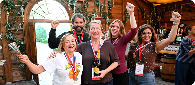 Content Without Borders delegates cheering after winning a challenge.