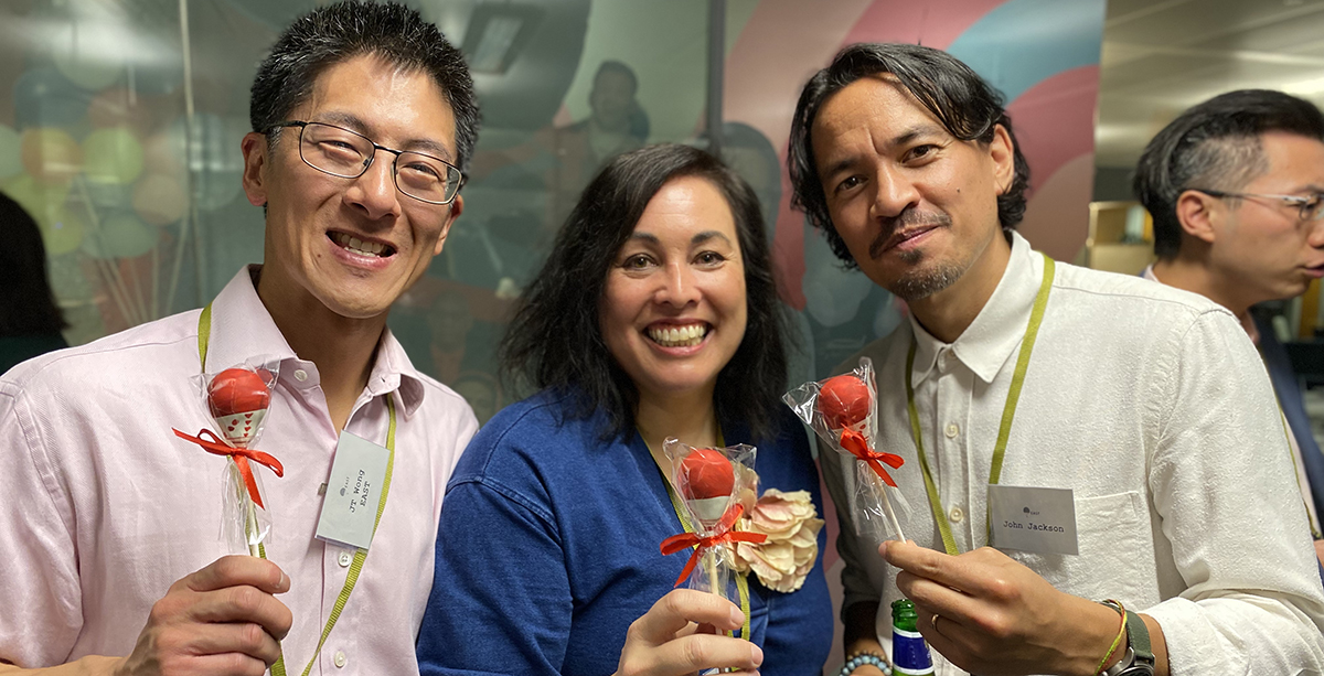 Event photo: EAST Founders from left: JT Wong, Emma Ko and John Jackson holding branded lollies.