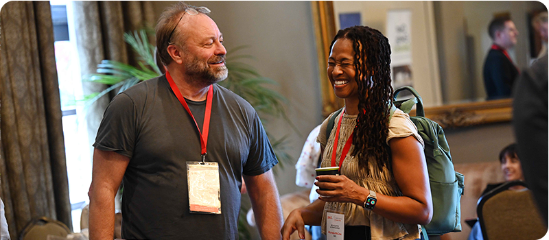 Content Without Borders delegates networking over coffee.