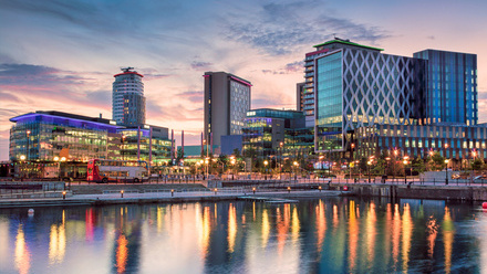 Sunset waterfront view of MediaCityUK in Salford.