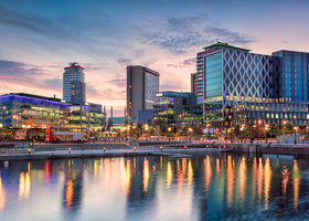 Sunset waterfront view of MediaCityUK in Salford.