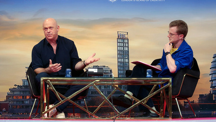 Ross Kemp in conversation at MPTS 2025 on stage in front of a cloudy sky background.