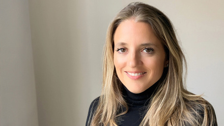 Headshot: Rachel Vecht, a woman with long blonde hair wearing a black turtleneck top.