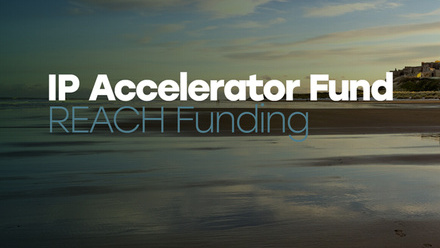 Coastal landscape with a text overlay reading 'IP Accelerator Fund REACH Funding.'