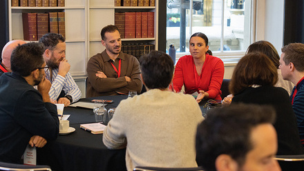A group of delegates participating in a roundtable.