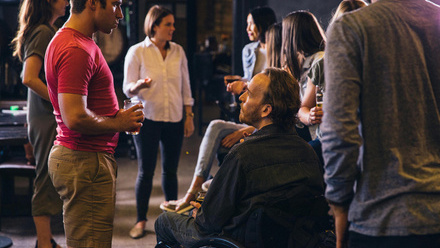 Diverse group of creative professionals at a networking drinks.