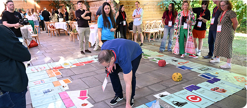 Delegates playing a giant board game at Content Without Borders 2026.