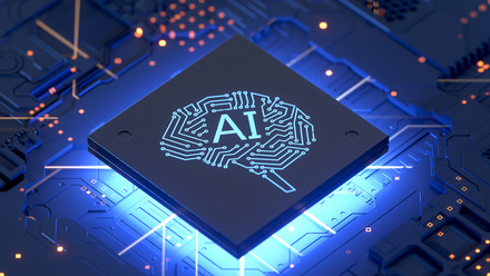Image of a computer chip in futuristic blue and orange tones with the letters AI in large in the centre of a brain graphic.
